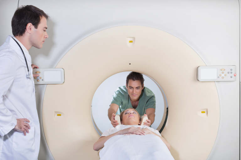 Gamma knife surgery - Male nurse preparing patient for CT scan