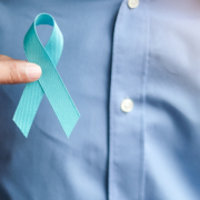 Radiotherapy Centre - Man holding light Blue Ribbon