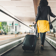 radiotherapy centre - Woman traveller with travel suitcase