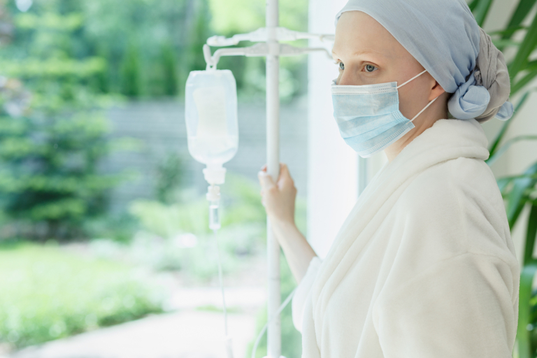 Radiotherapy centre - woman with drip