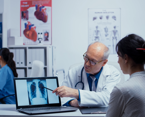 radiotherapy centre - doctor talking with patient about lungs