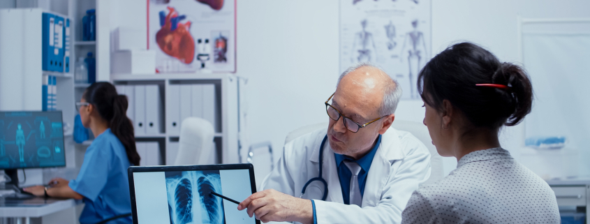 radiotherapy centre - doctor talking with patient about lungs