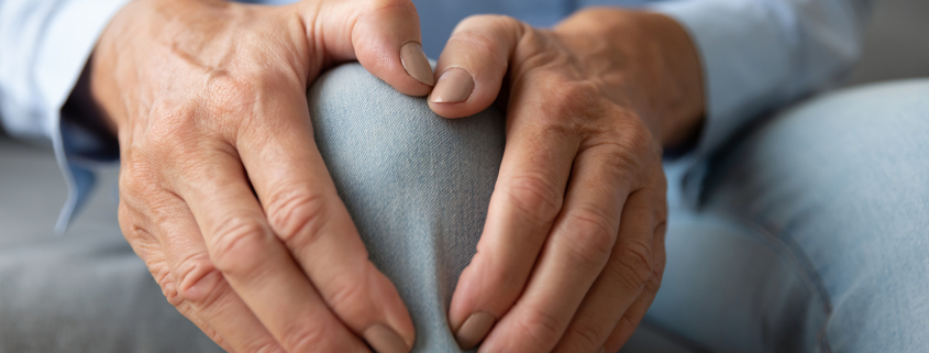 External radiation - Old woman touching knee feeling pain