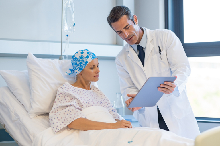 novocure - Doctor showing medical records to cancer patient