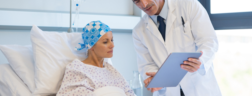 novocure - Doctor showing medical records to cancer patient