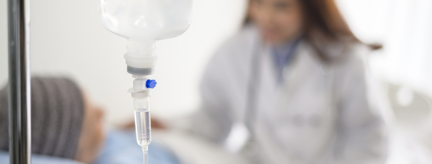 radiotherapy centre - cancer patient woman wearing head scarf