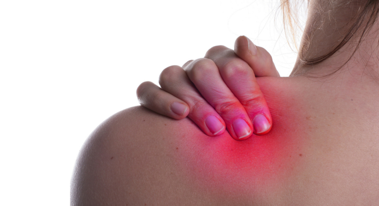 radiotherapy centre - woman hold her shoulder in pain