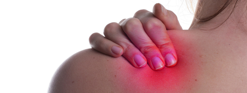 radiotherapy centre - woman hold her shoulder in pain
