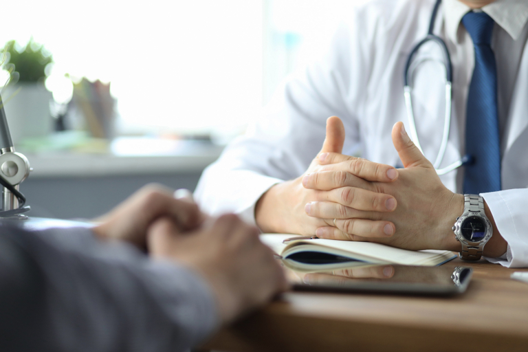 radiotherapy centre austria - Male doctor giving a consultation to a patient