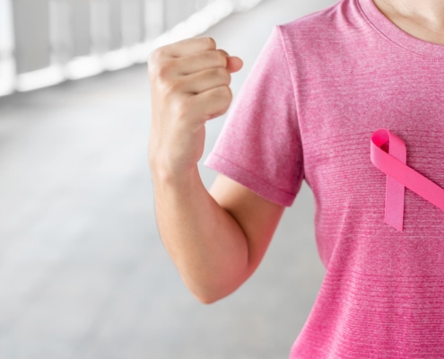 radiotherapy centre- Woman in pink T- shirt with Pink Ribbon