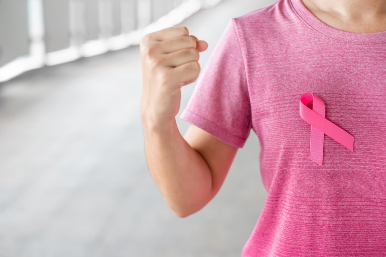 radiotherapy centre- Woman in pink T- shirt with Pink Ribbon